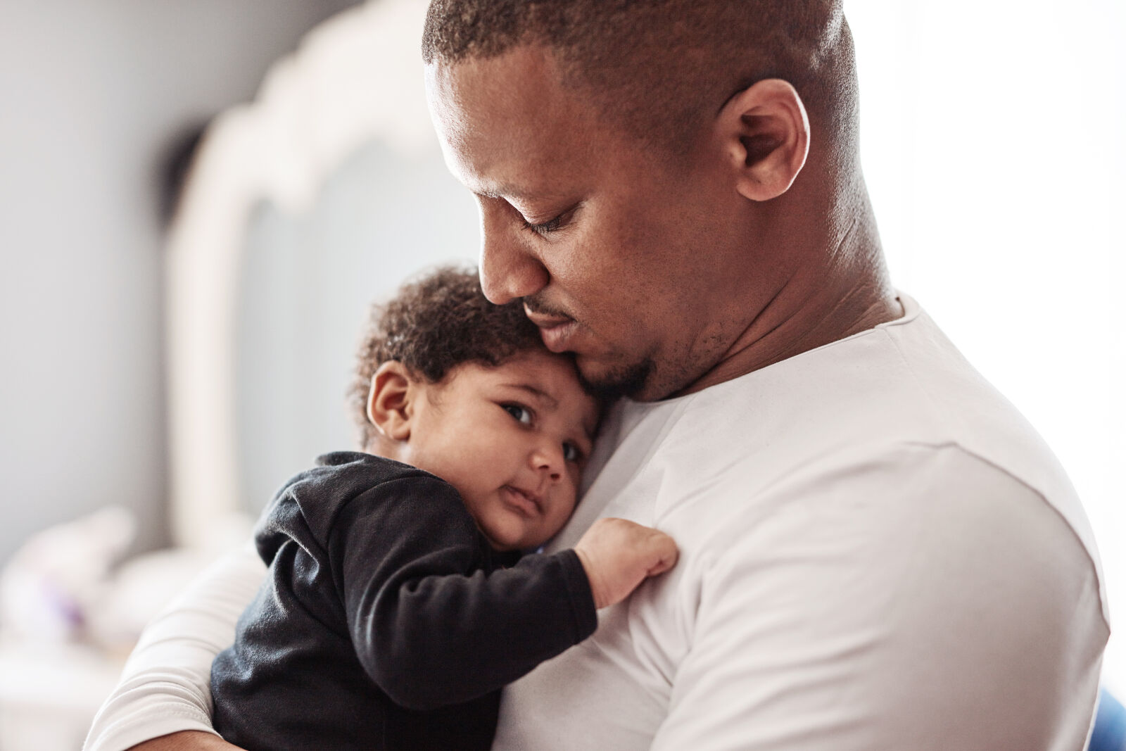 man holding baby