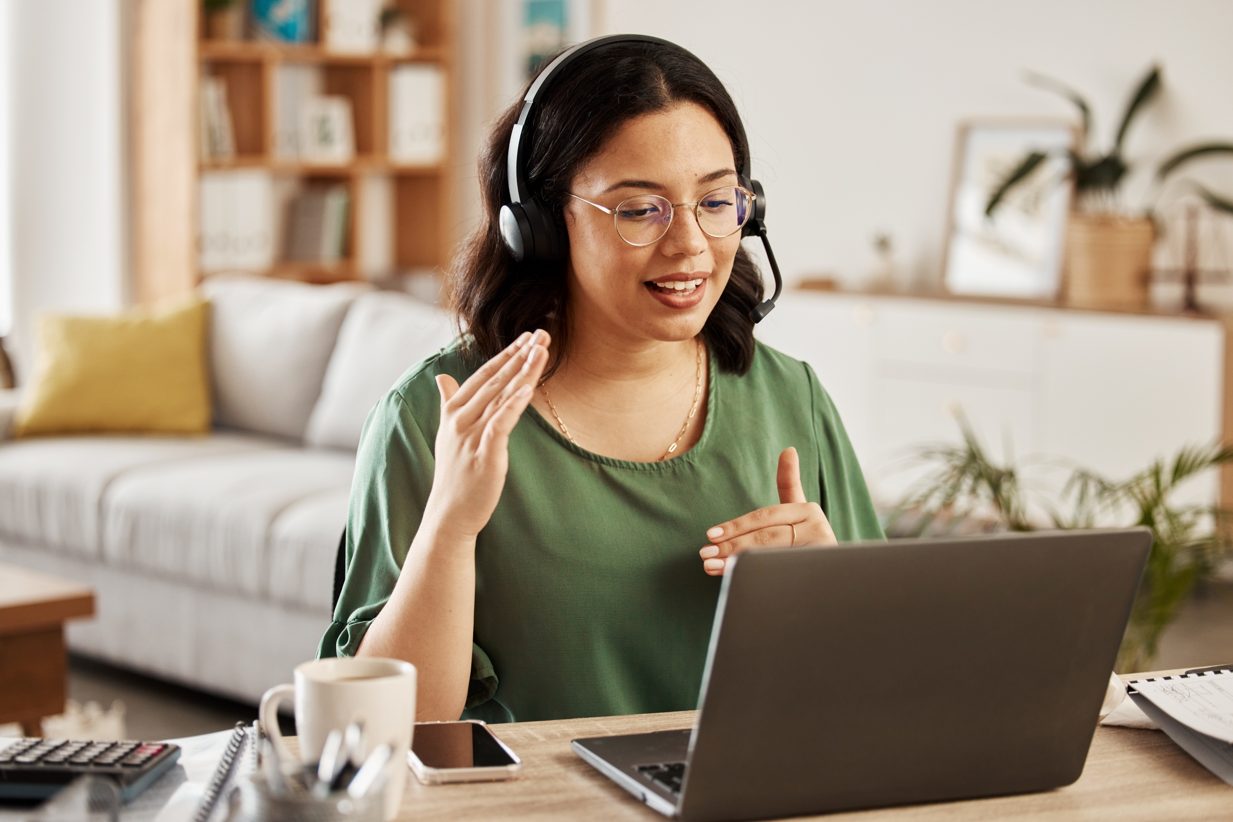 woman on laptop with headphones