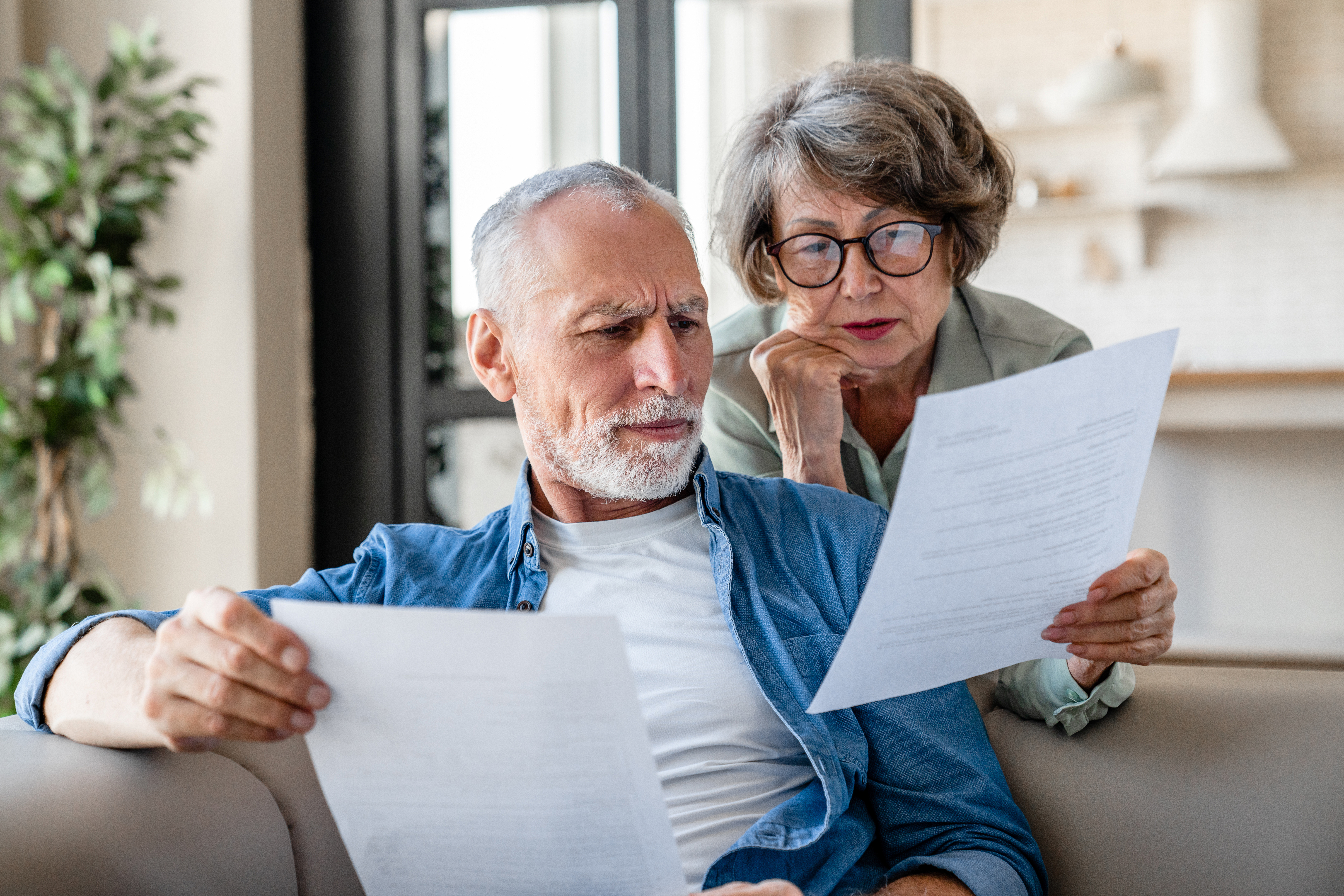 A couple looking at paperwork.